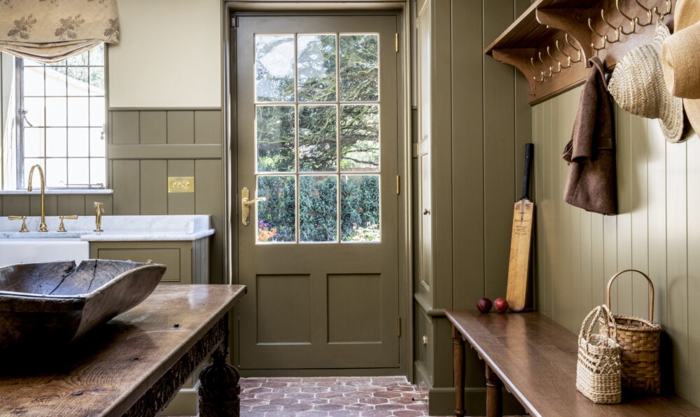 Boot room showing back door and antique table
